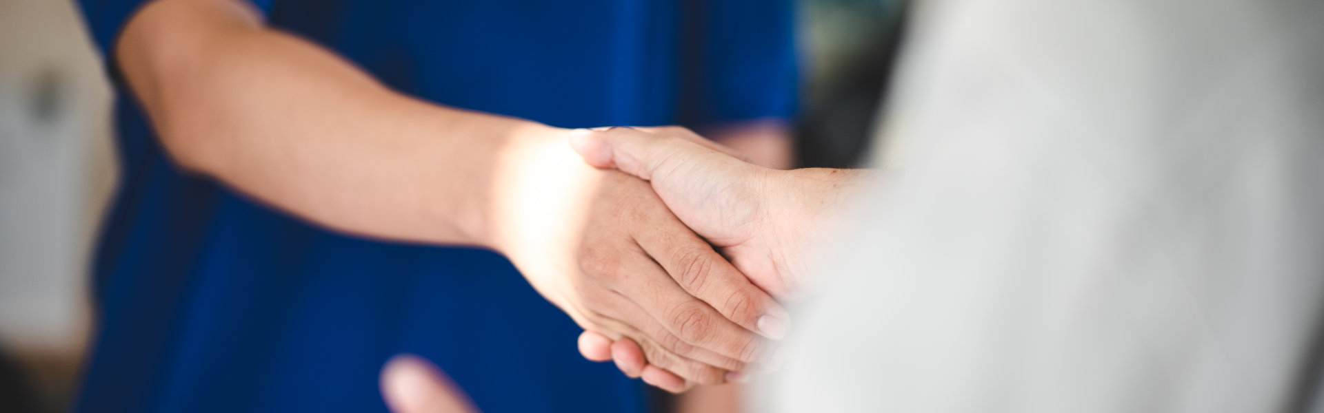 A person in a blue shirt interacts with digital security icons and a globe, emphasizing cybersecurity and data protection.